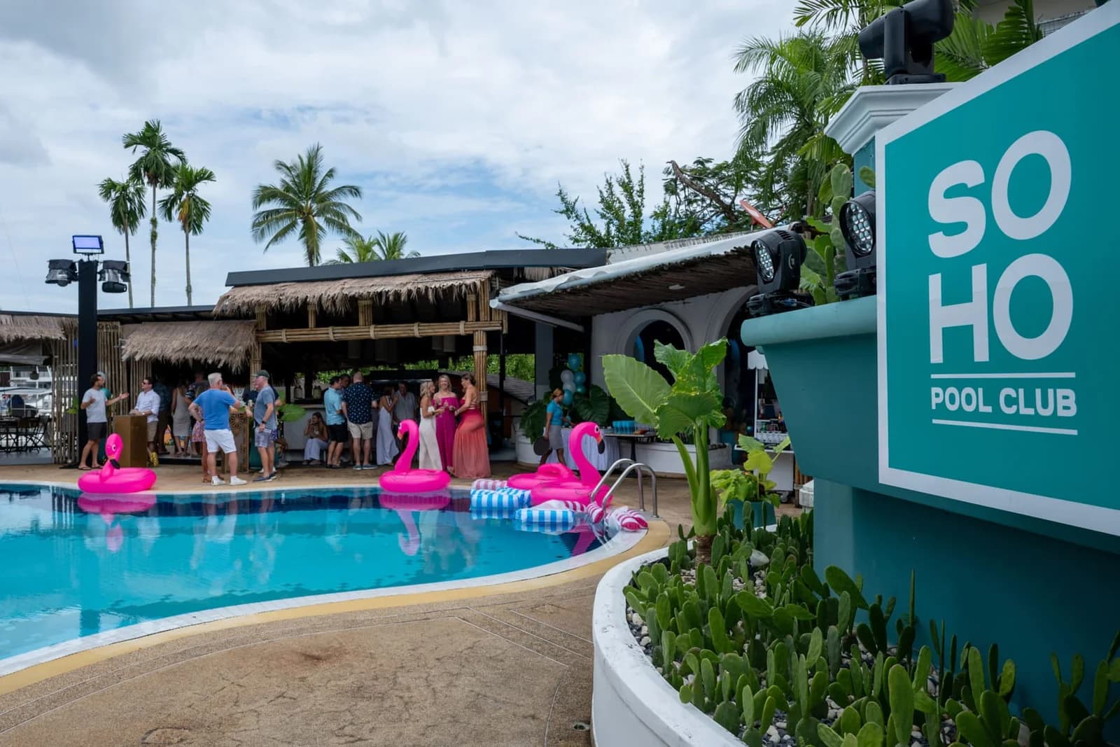Guests celebrating a private party by the pool at SOHO Pool Club, Boat Lagoon Marina